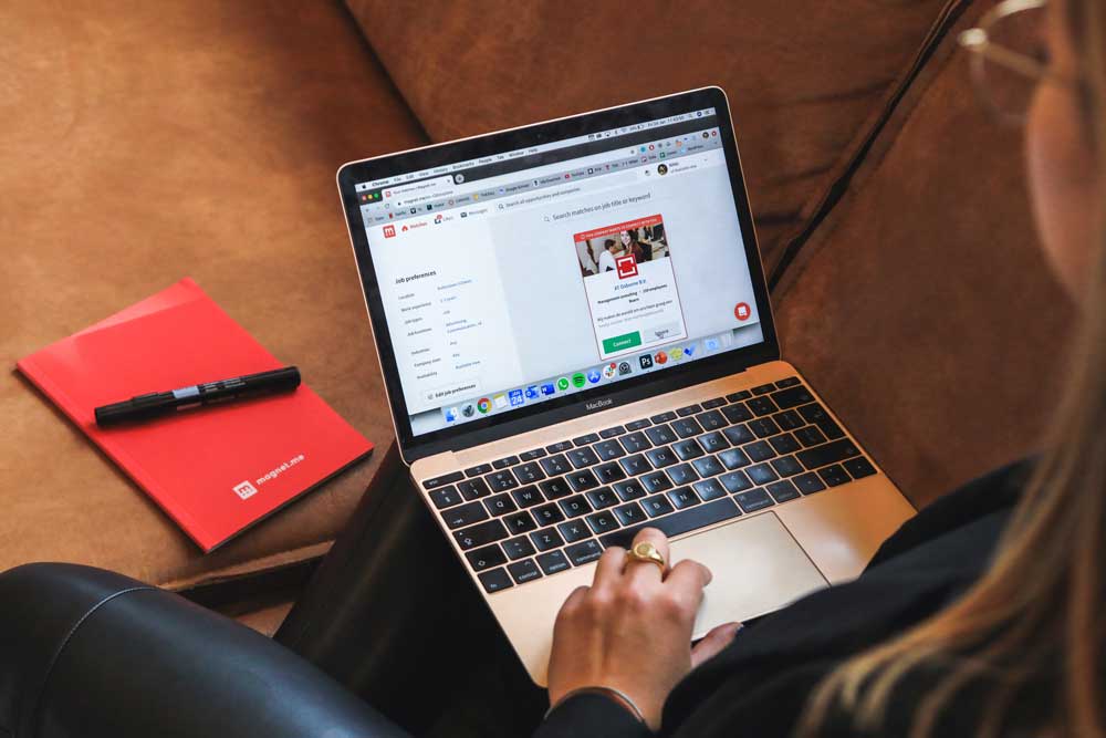 someone sitting down and typing at a computer