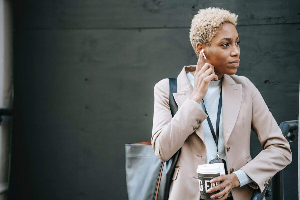 a woman standing on a street taking a phone call